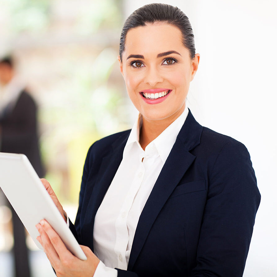 beautiful female corporate worker with tablet computer in office